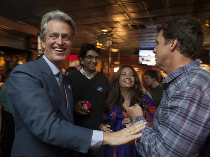 Los Angeles 3rd District supervisor candidate Bobby Shriver, left, greets supporters during his campaign party at O'Brien's Irish Pub in Santa Monica.