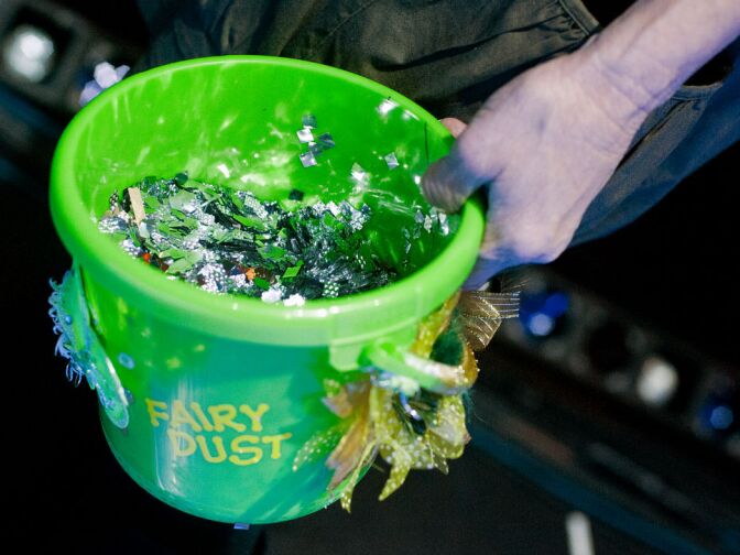 Cathy Rigby holds a bucket of fairy dust. After past productions of Peter Pan at the Pantages Theatre, the dust has lingered in the theater for up to five months.