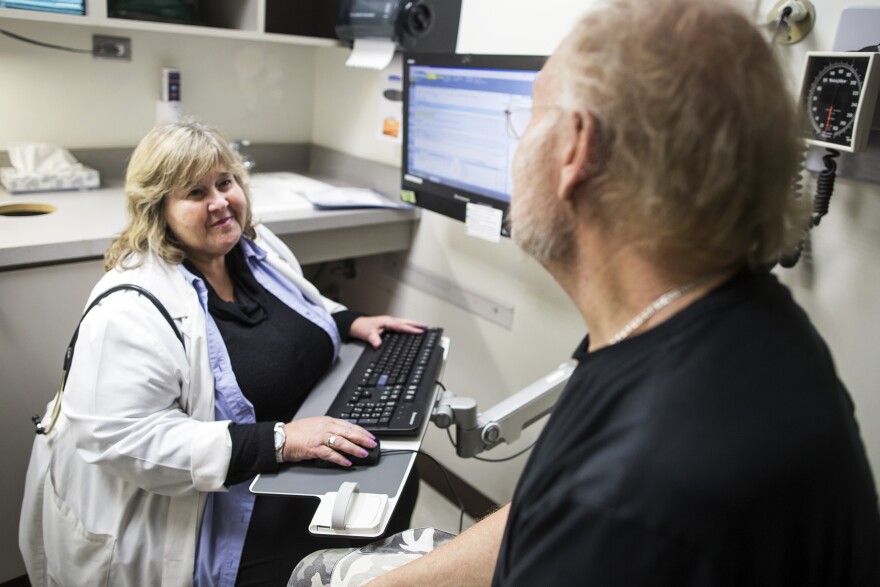 Family Nurse Practitioner Stacey Nadler, left, meets with client Chance Reardan, 66, during a check-up at Saban Community Clinic on Monday afternoon, Dec. 5, 2016. The Affordable Care Act expansion made a huge difference in the clinic's financial bottom line, says CEO Julie Hudman. The clinic was able to provide more services including shower services.