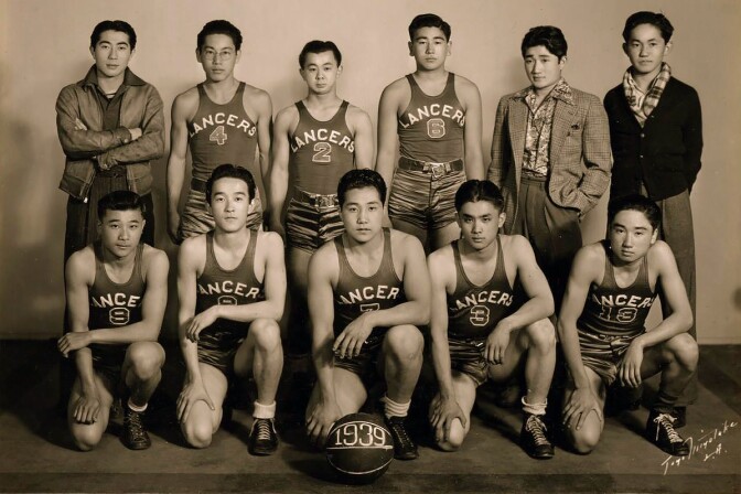 The Lancers, a Los Angeles-based Japanese American league basketball team, pose for a team portrait in 1939.