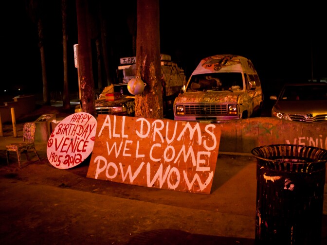 A sign on the Venice Boardwalk titled, "All Drums Welcome Pow Wow." 