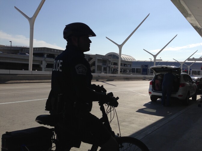Airport Police Officer O. Gatewood on bike patrol outside Tom Bradley International Airport Thursday, Oct. 30, 2014.