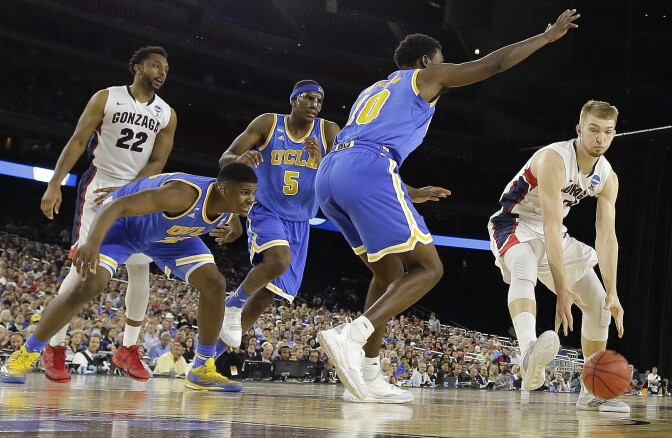Gonzaga's Domantas Sabonis drives against UCLA's Isaac Hamilton (10) during the second half of a college basketball regional semifinal game in the NCAA Tournament Friday, March 27, 2015, in Houston. (AP Photo/David J. Phillip)