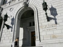 A woman walks into the State of California Earl Warren building Jan. 22, 2007, in San Francisco, Calif.