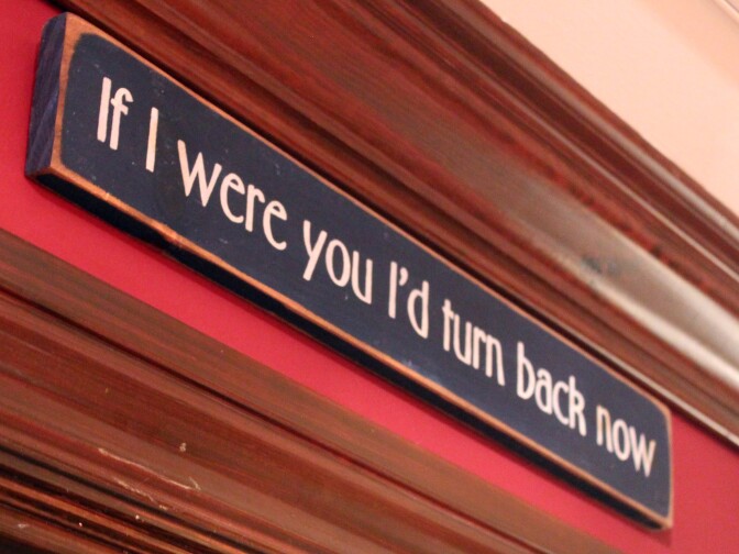 The sign in the first floor hallway of "Bleak House" reads "If I were you I'd turn back now." 