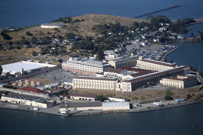 San Quentin prison, which has gothic-style architecture, is surrounded on three sides by water.