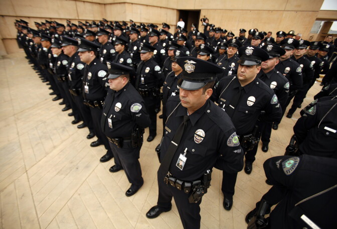 LOS ANGELES, CA  - APRIL 22:  LAPD officers fill the Cathedral of Our Lady of the Angels fro teh funeral of Los Angeles Police Dept. (LAPD) motor officer Chris Cortijo April 22, 2014 in Los Angeles, California. Cortijo, a LAPD member for nearly 27 years, died four days after he was struck by an allegedly impaired driver in a Chevrolet Blazer on April 5, while stopped at a red light on Saticoy Street and Lankershim Boulevard in Sun Valley.  (Photo by Al Seib-Pool/Getty Images)