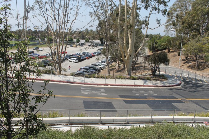 A parking lot next to a road