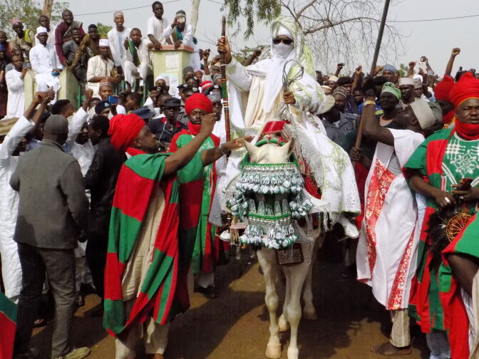 Emir of Kano Muhammadu Sanusi II (C) departs on horseback from the Eid prayer ground in Kano on June 25, 2017, after prayers to mark the end of the holy month of Ramadan and the start of the Eid al-Fitr Festival. 			 / AFP PHOTO / AMINU ABUBAKAR        (Photo credit should read AMINU ABUBAKAR/AFP/Getty Images)