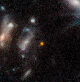 The reddish dot is at the center of a close-up of larger image