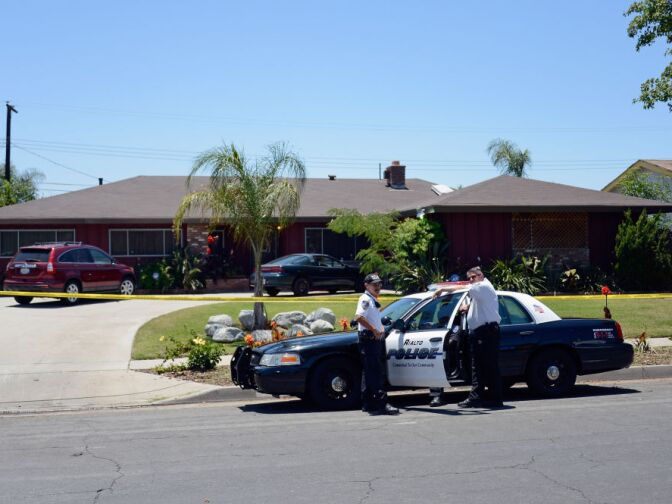 Rialto police officers and volunteers keep watch in front of Rodney King's home after he was found dead on June 17, 2012 in Rialto, California. King, whose video beating by Los Angeles police in 1991 sparked riots after the acquittal of the four officers involved, was found dead at the age of 47 from an apparent drowning in his swimming pool.