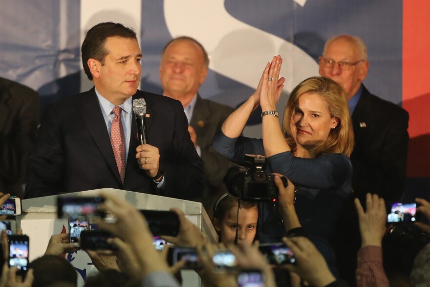 Republican presidential candidate Sen. Ted Cruz (R-TX) stands with his wife Heidi as he addresses supporters after winning at an Iowa caucus night gathering.