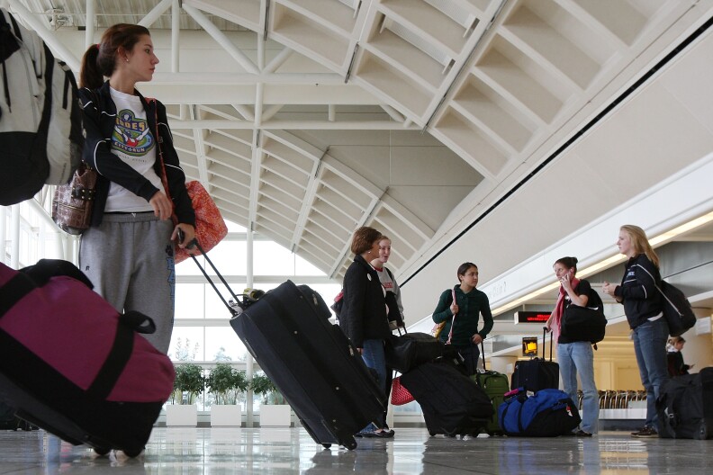 Travelers pass through L.A./ Ontario International Airport.