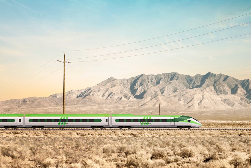 A rendering of a train traveling across a desert scape. Power lines are visible and arid hills. the train is racing green and white.