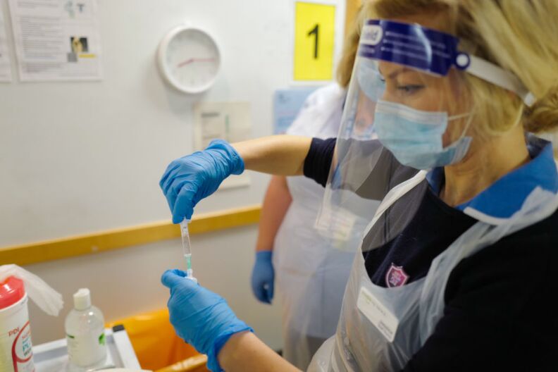 TRURO, ENGLAND - DECEMBER 09: A staff nurse at the Royal Cornwall Hospital prepares to administer  Covid-19 vaccinations as the hospital began their vaccination programme on December 9, 2020 in Truro, United Kingdom. More than 50 hospitals across England were designated as covid-19 vaccine hubs, the first stage of what will be a lengthy vaccination campaign. NHS staff, over-80s, and care home residents will be among the first to receive the Pfizer/BioNTech vaccine, which recently received emergency approval from the country's health authorities. (Photo by Hugh Hastings/Getty Images)