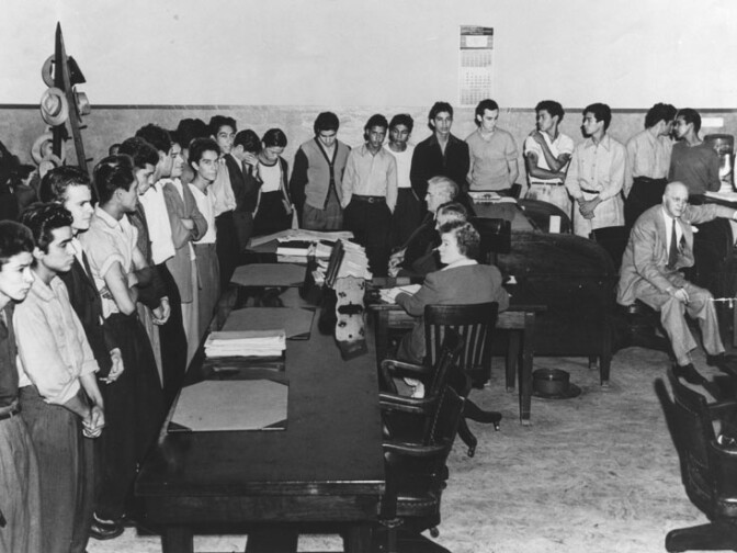 In an unusual procedure, 23 youths were indicted by the County Grand Jury for the gang murder of Jose Diaz, 22, near "Sleepy Lagoon," an abandoned gravel pit near Slauson and Atlantic boulevards. On August 10, 1942 they were arraigned in Superior Judge E. R. Brand's court. 