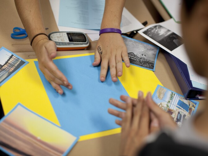 Students in Sunshine Cavalluzzi's social science class create a collage of poems and pictures at El Dorado High School in Placentia.