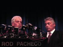 Joseph Bonaminio (left), the father of slain Riverside policeman Ryan Bonaminio, and Riverside County District Attorney Rod Pacheco announce the charges against suspected killer Earl Ellis Green at a Tuesday news conference. 