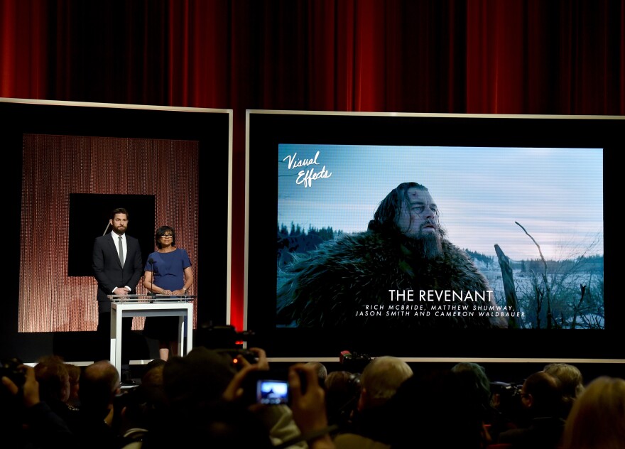 LOS ANGELES, CA - JANUARY 14:  Actor John Krasinski and President of the Academy of Motion Picture Arts and Sciences Cheryl Boone Isaacs announce 'The Revenant' as a nominee for Best Visual Effects during the 88th Oscars Nominations Announcement at the Academy of Motion Picture Arts and Sciences on January 14, 2016 in Los Angeles, California.  (Photo by Kevin Winter/Getty Images)