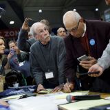 DES MOINES, IA - FEBRUARY 03: Officials from the 68th caucus precinct overlook the results of the first referendum count during a caucus event on February 3, 2020 at Drake University in Des Moines, Iowa, United States. Iowa is the first contest in the 2020 presidential nominating process with the candidates then moving on to New Hampshire. (Photo by Tom Brenner/Getty Images)