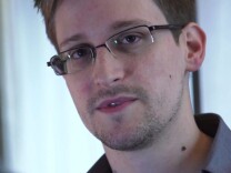 A lawyer advising National Security Agency leaker Edward Snowden said Wednesday Snowden's asylum status has not been resolved and that he is going to stay at the Moscow airport for now.