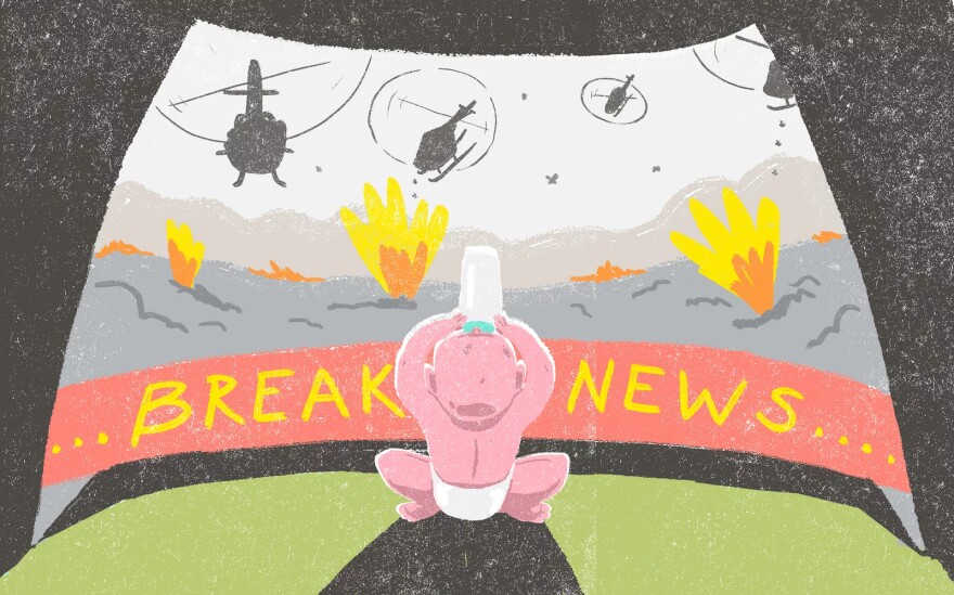 An illustration shows a child in a diaper holding a baby bottle and sitting in front of a breaking news banner and helicopters flying overhead.
