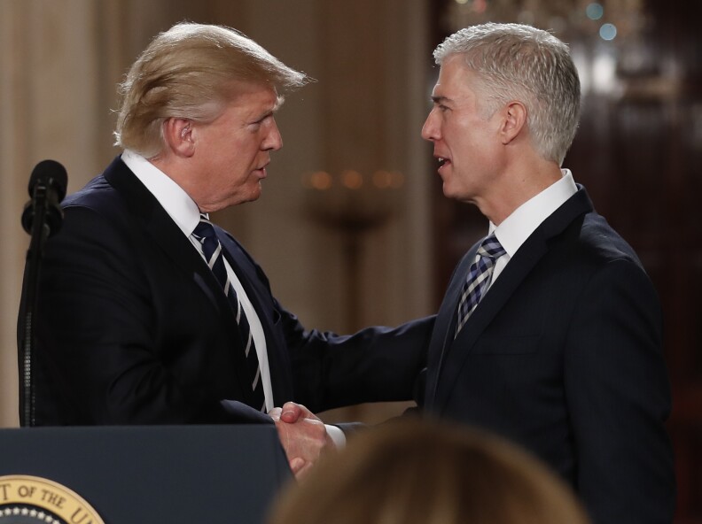 President Donald Trump shakes hands with 10th U.S. Circuit Court of Appeals Judge Neil Gorsuch, his choice for Supreme Court Justices in the East Room of the White House in Washington, Tuesday, Jan. 31, 2017.