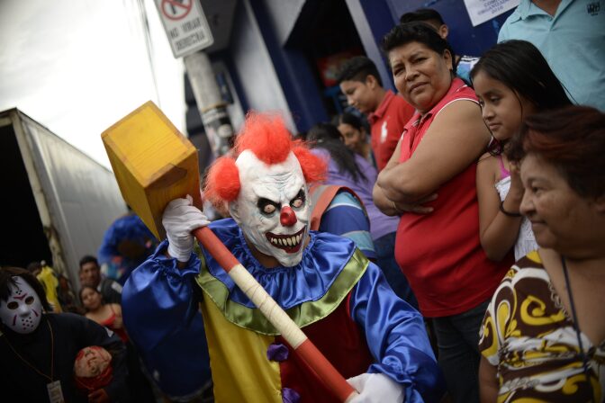 A reveler takes part in the traditional "Convite de fieros" festival as part of All Saints Day celebrations in Villa Nueva, Guatemala on November 1, 2016.