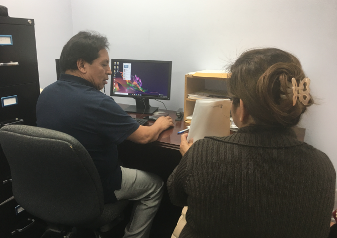 Dilcia Inestroza obtains help with her renewal application for Temporary Protected Status at El Rescate, a community organization and legal clinic just outside downtown Los Angeles. An immigrant from Honduras, she's had the protection for almost 20 years. The Trump administration has canceled TPS for immigrants from El Salvador, Haiti, Nicaragua and Sudan. Hondurans fear they could be next.