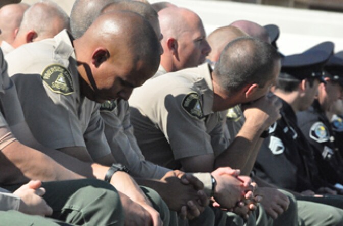 Members of the Riverside County Sheriff's Department pay their respects to Riverside Police Officer Ryan Bonaminio on Tuesday, Nov. 16, 2010.