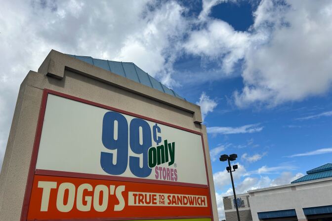 A mall sign wit 99 cents only stores sign on it.