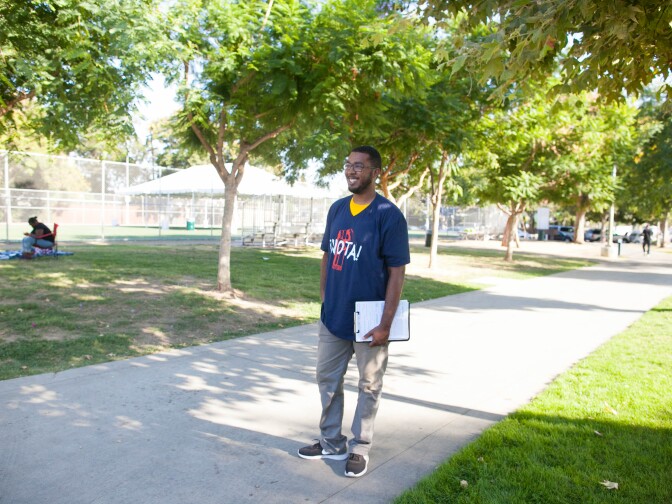 Jantson Green waits for festival goers, as he seeks to register more people to vote in November's general election. He had already surpassed his goal for the afternoon, registering seven new voters at the 5th annual Power Fest Music and Art Festival in Martin Luther King Jr. Park on Saturday, Sept. 3, 2016.