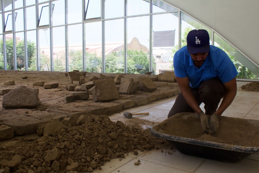Rafa Esparza puts together the final bricks for "Tierra," his piece at the Hammer Museum's "Made in LA" biennial.