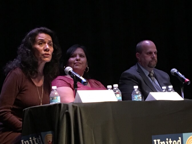 Los Angeles Unified School Board candidate Lisa Alva (left) speaks during a forum for candidates in District 2, which covers central and east L.A., as incumbent Mónica García (center) and candidate Carl Petersen sit nearby.