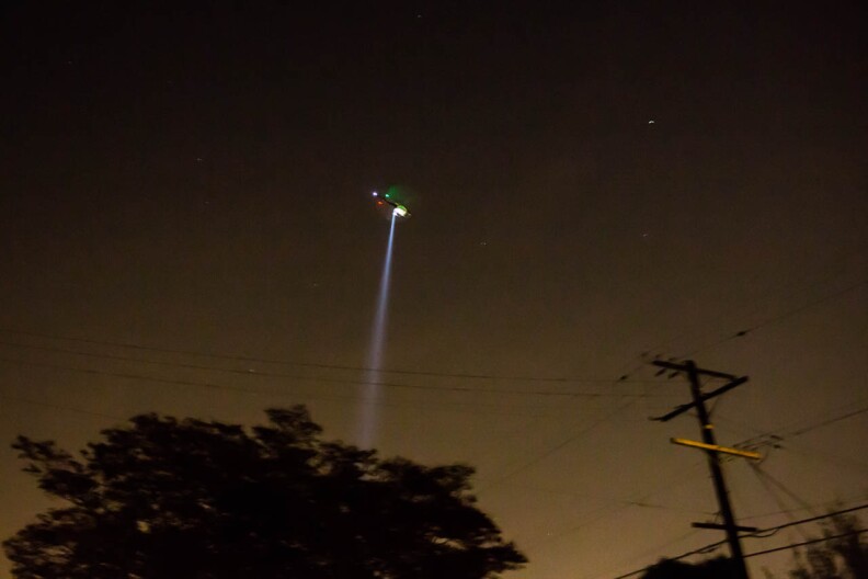 A Los Angeles Police Department Helicopter hovers over Highland Park in northeast Los Angeles on April 13, 2013.
