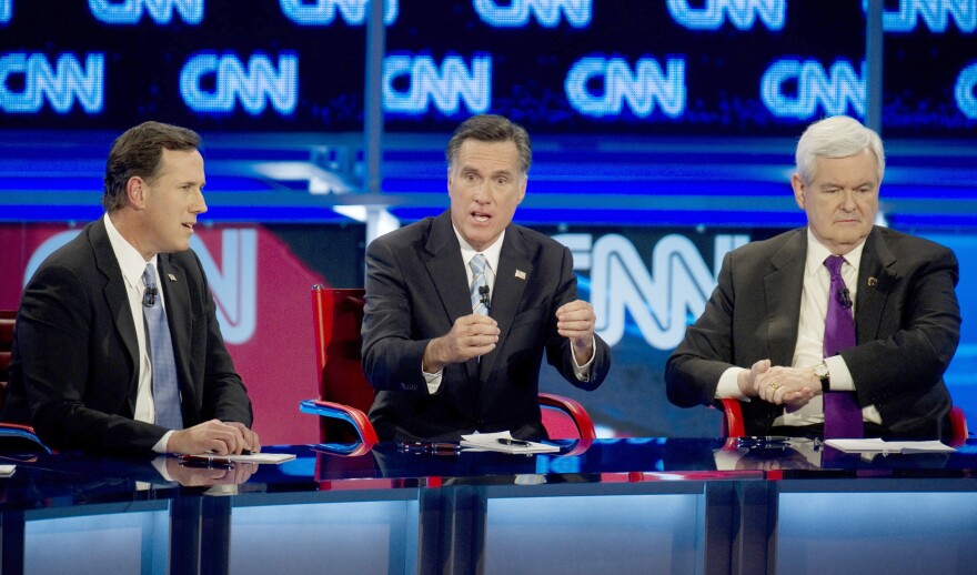 Republican presidential candidates Rick Santorum (L), Mitt Romney (C) and Newt Gingrich debate on February 22, 2012 in Mesa, Arizona. The Arizona and Michigan primaries are scheduled to be held February 28.    AFP PHOTO/DON EMMERT (Photo credit should read DON EMMERT/AFP/Getty Images)