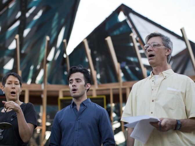 Michelle Shocked, left, David Castillo and Paul Berkolds take part in a rehearsal of the final scene of the mobile opera "Hopscotch" on Friday, Oct. 23, 2015. The performance runs on weekends only from Oct. 31 to Nov. 15.