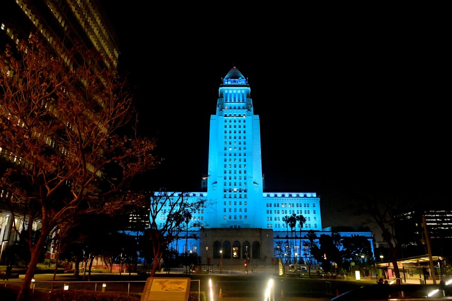 LOS ANGELES, CA - APRIL 16: Los Angeles City Hall is lit up in blue on April 16, 2020 in Los Angeles, California, United States. Landmarks and buildings across the nation are displaying blue lights to show support for health care workers and first responders on the front lines of the COVID-19 pandemic. (Photo by Kevin Winter/Getty Images)