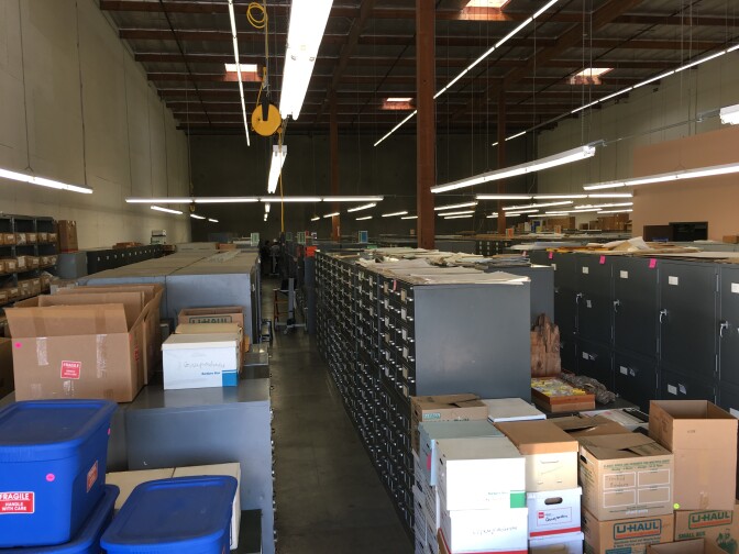 The NHM's warehouse in Carson is about 10,000 square feet and packed with boxes and cabinets.