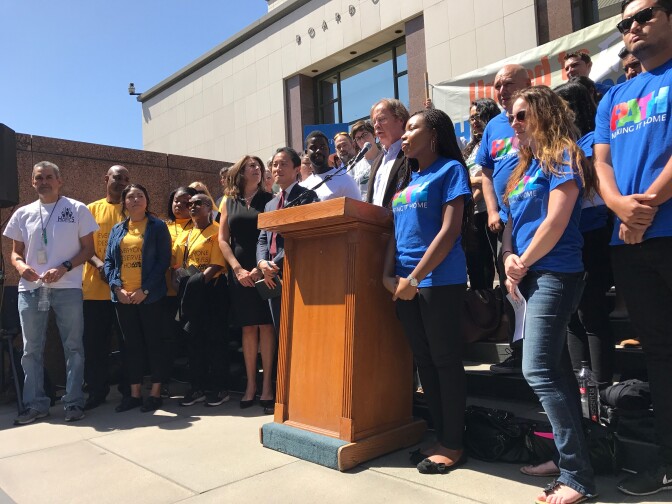 Homeless advocates celebrated outside the county building as the Board of Supervisors took up a massive spending plan to tackle homelessness. 