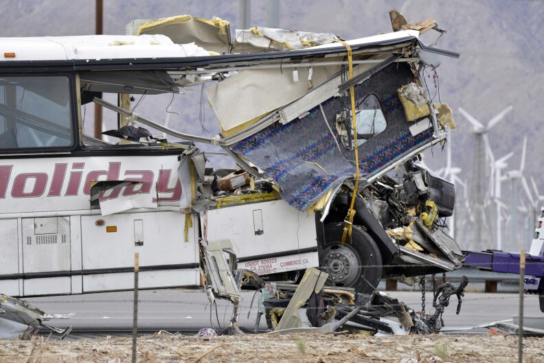 The damaged front of a tour bus is seen that crashed into the back of a semi-truck on Interstate 10 just north of the desert resort town of Palm Springs, in Desert Hot Springs, Calif., Sunday, Oct. 23, 2016. Several deaths and injuries were reported. (AP Photo/Rodrigo Pena)