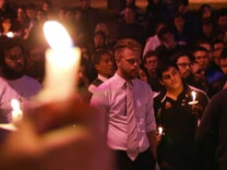 Hundreds of people gathered for a vigil in Woodland Hills last night to remember a 20-year-old shot and killed by police last week in Long Beach.