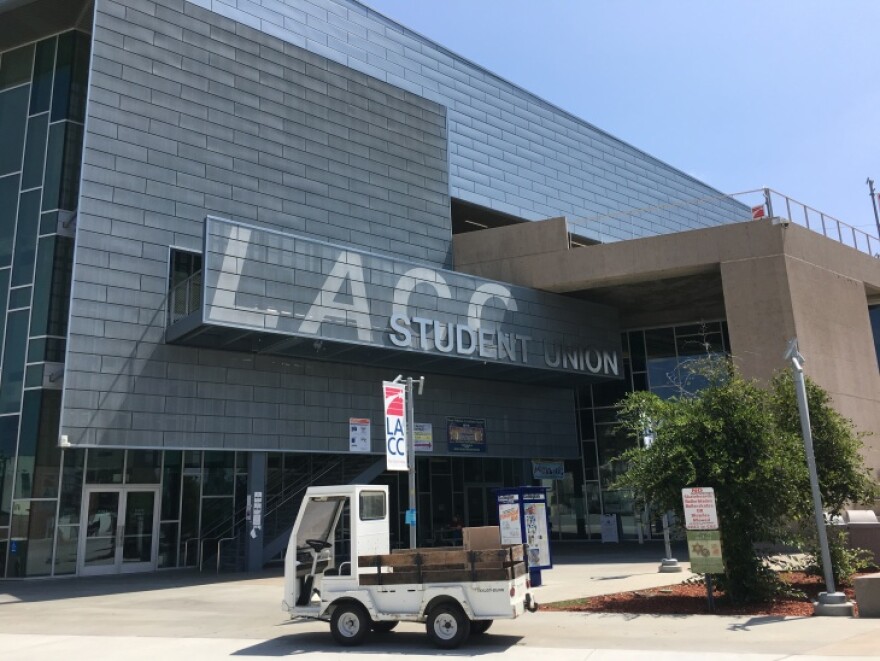 A gray brick building with the letters LACC across the front.