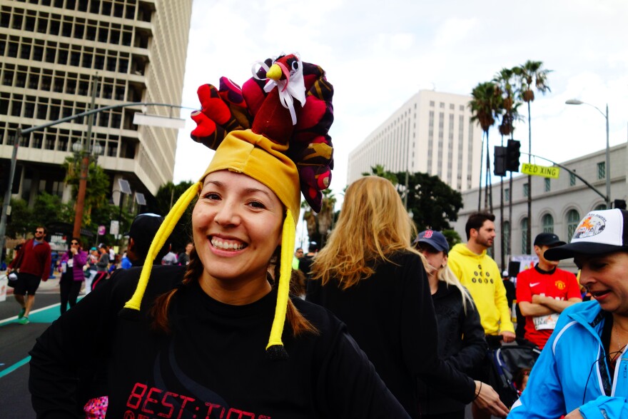 Jazmin Ortega models a turkey hat crafted for her by her sister. Ortega said the legs flapped in her face while running in the Nov. 28, 2013 Turkey Trot LA. in Downtown Los Angeles.