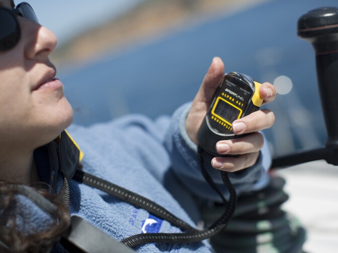 Research assistant Shana Rapport logs the time in between blows by a pair of gray whales off the coast of Palos Verdes on Monday, March 30, 2015.