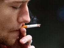 FIle: Isaiah Atkinson smokes a cigarette in front of the San Francisco Centre on May 31, 2011 in San Francisco.
