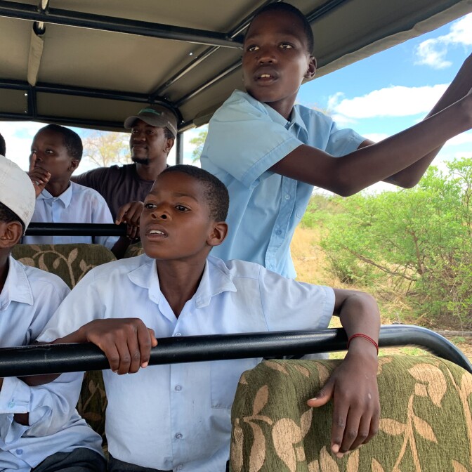 Fortune (standing) is often quiet and reserved. But on the safari drive his shyness gives way to excitement as soon as he starts spotting the animals.