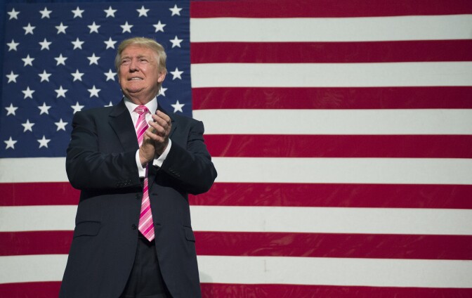 Republican presidential nominee Donald Trump takes the stage for a campaign event at Fredericksburg Expo Center in Fredericksburg, Virginia. 