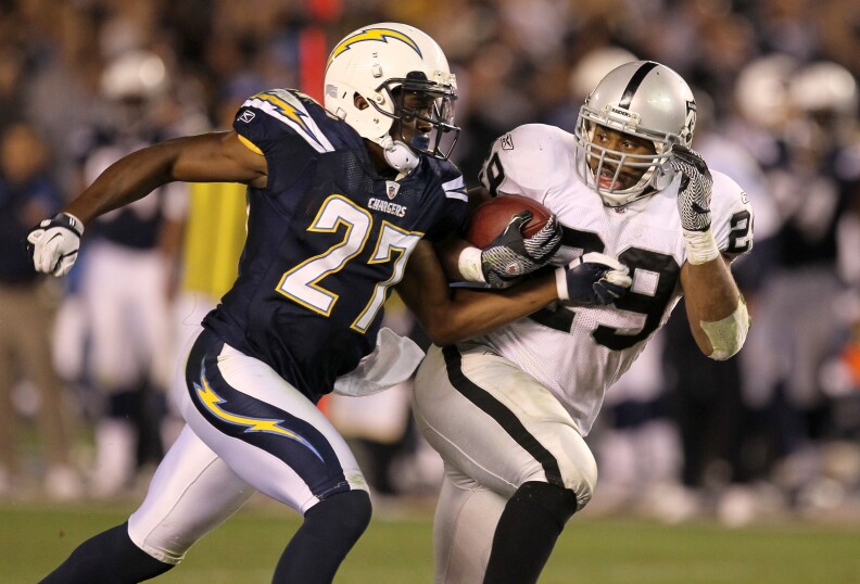 SAN DIEGO, CA - NOVEMBER 10:  Running back Michael Bush #29 of the Oakland Raiders carries the ball against safety Paul Oliver #27 of the San Diego Chargers at Qualcomm Stadium on November 10, 2011 in San Diego, California.  The Raiders won 24-17.  (Photo by Stephen Dunn/Getty Images)
