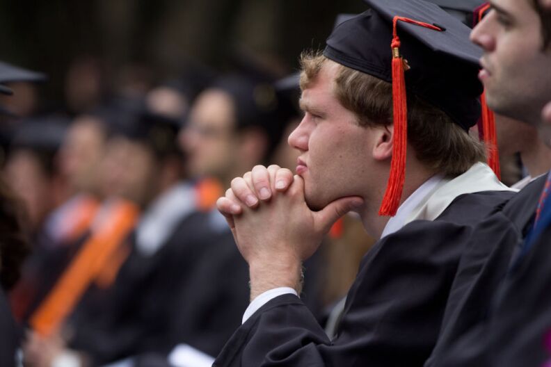 A graduate gives his undivided attention to Elon Musk's commencement speech during the Caltech graduation ceremony on June 15, 2012.